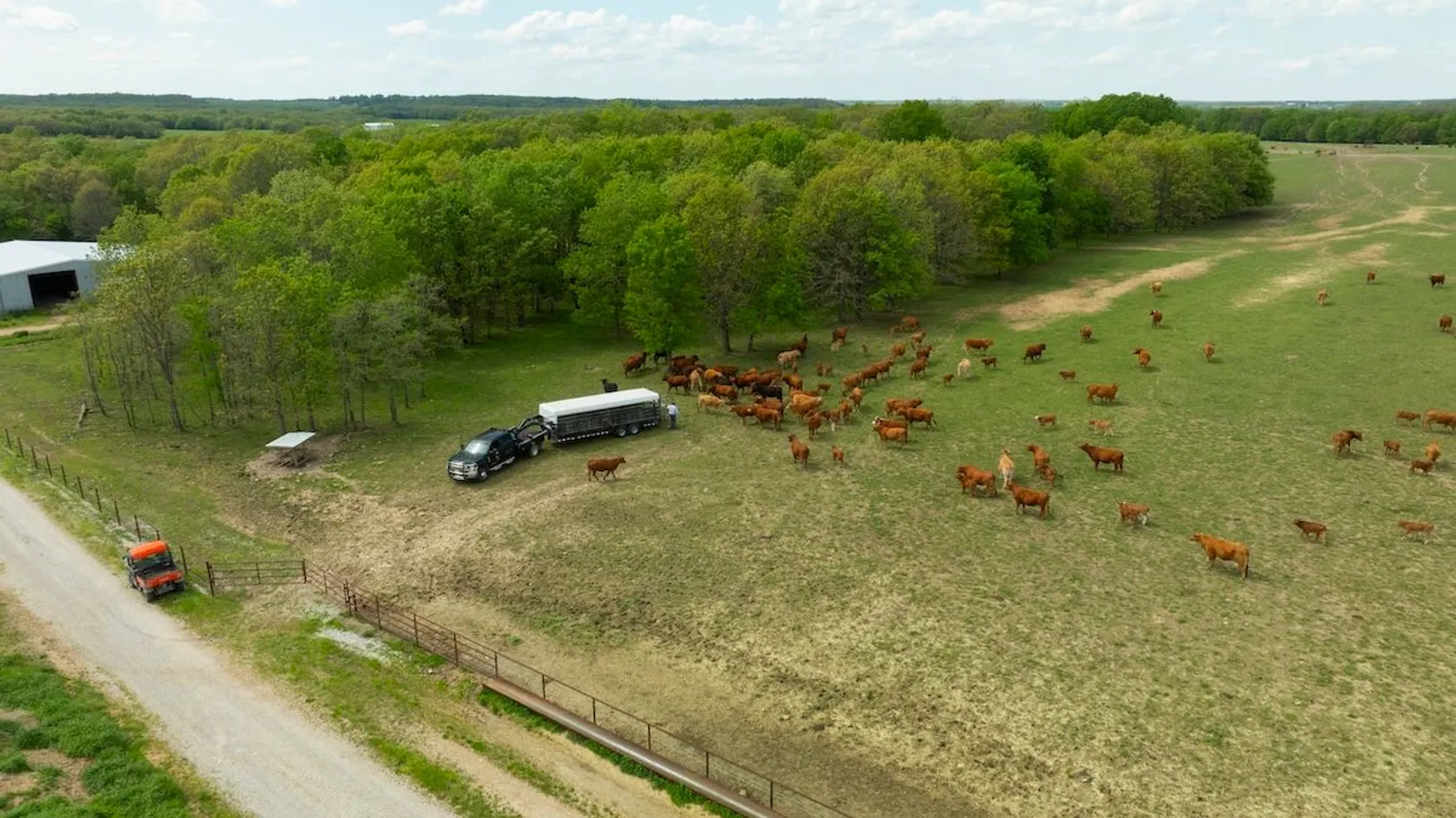 Aerial view of rural farmland with agricultural fields and farm buildings, showing typical land where mineral rights questions arise